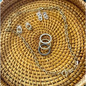 Gold tone and silver tone jewelry set.toggle necklace, earrings and rings